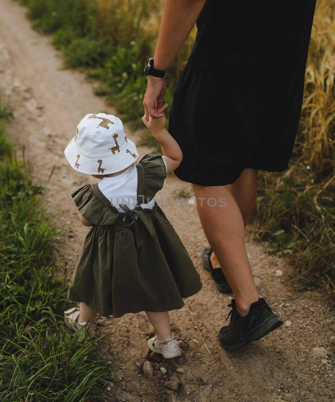 Happy father and child spending time outdoors. father with daughter in summer by paralisart