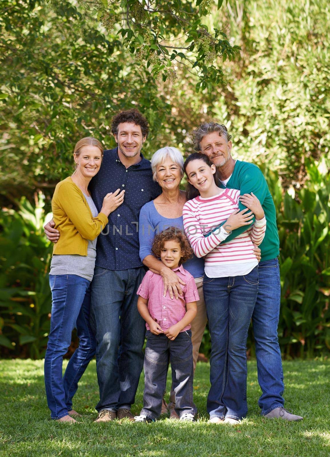 Family always comes first. Shot of a family posing for a photo. by YuriArcurs