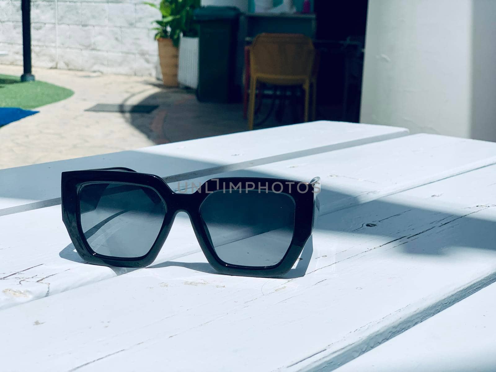 fashion sunglasses black on white wooden table. Vintage color style by juliet_summertime