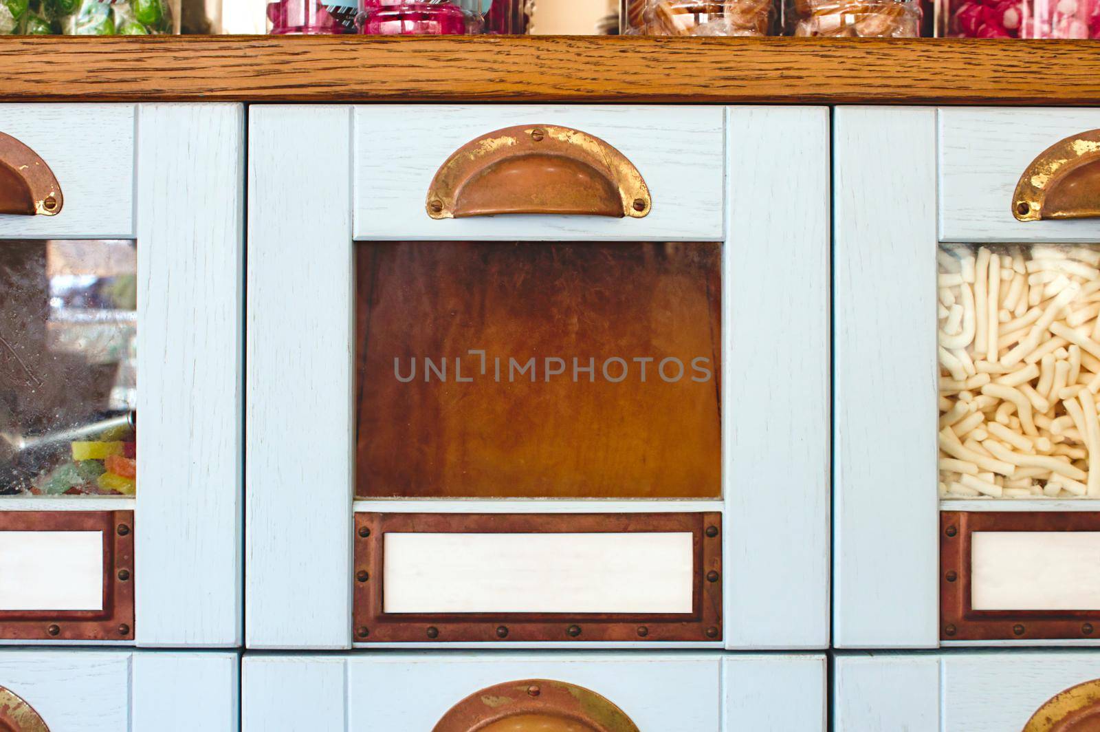 Empty box drawer with glass front in a display cabinet in a sweet shop - product template with copy space