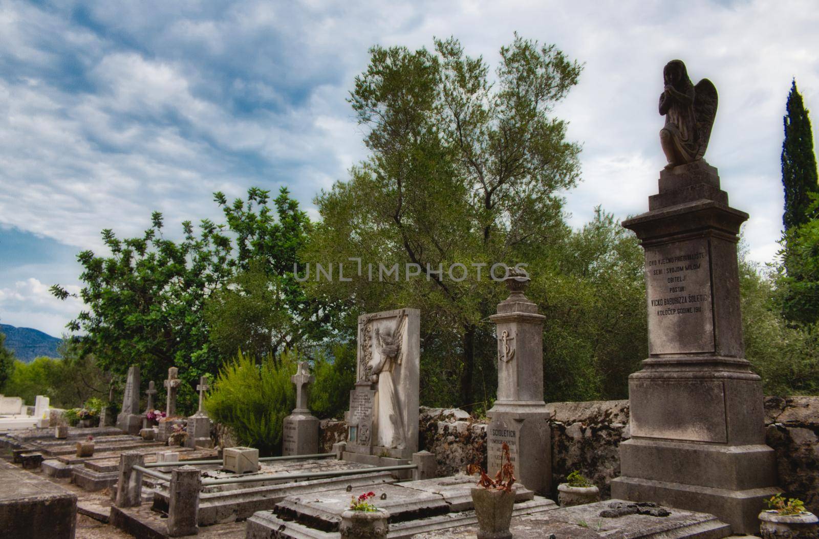 Tombs, statues and headstones in a graveyard