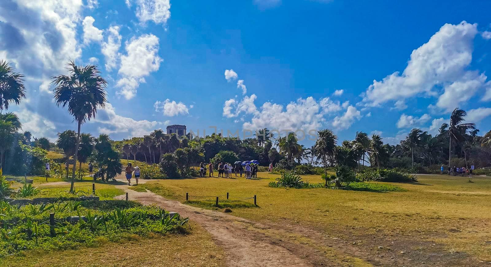 Tulum Mexico 21. February 2022 Ancient Tulum ruins Mayan site with temple ruins pyramids and artifacts in the tropical natural jungle forest palm and seascape panorama view in Tulum Mexico.