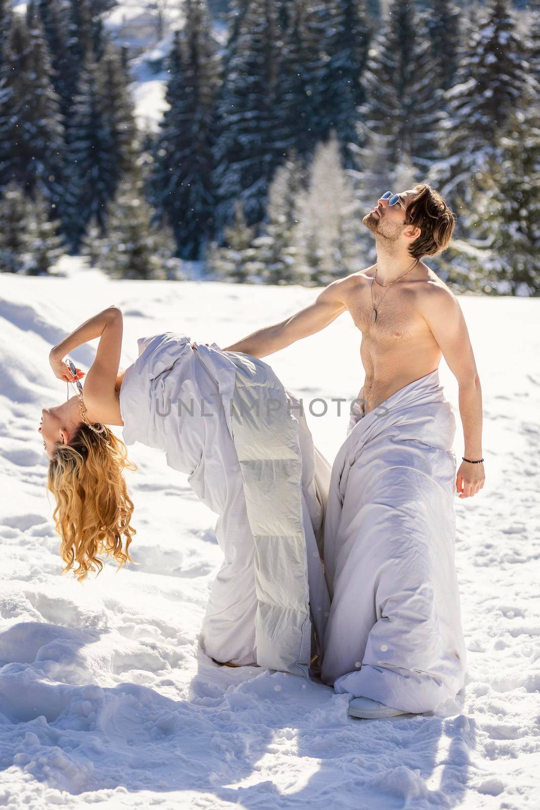 couple in blankets in winter by zokov