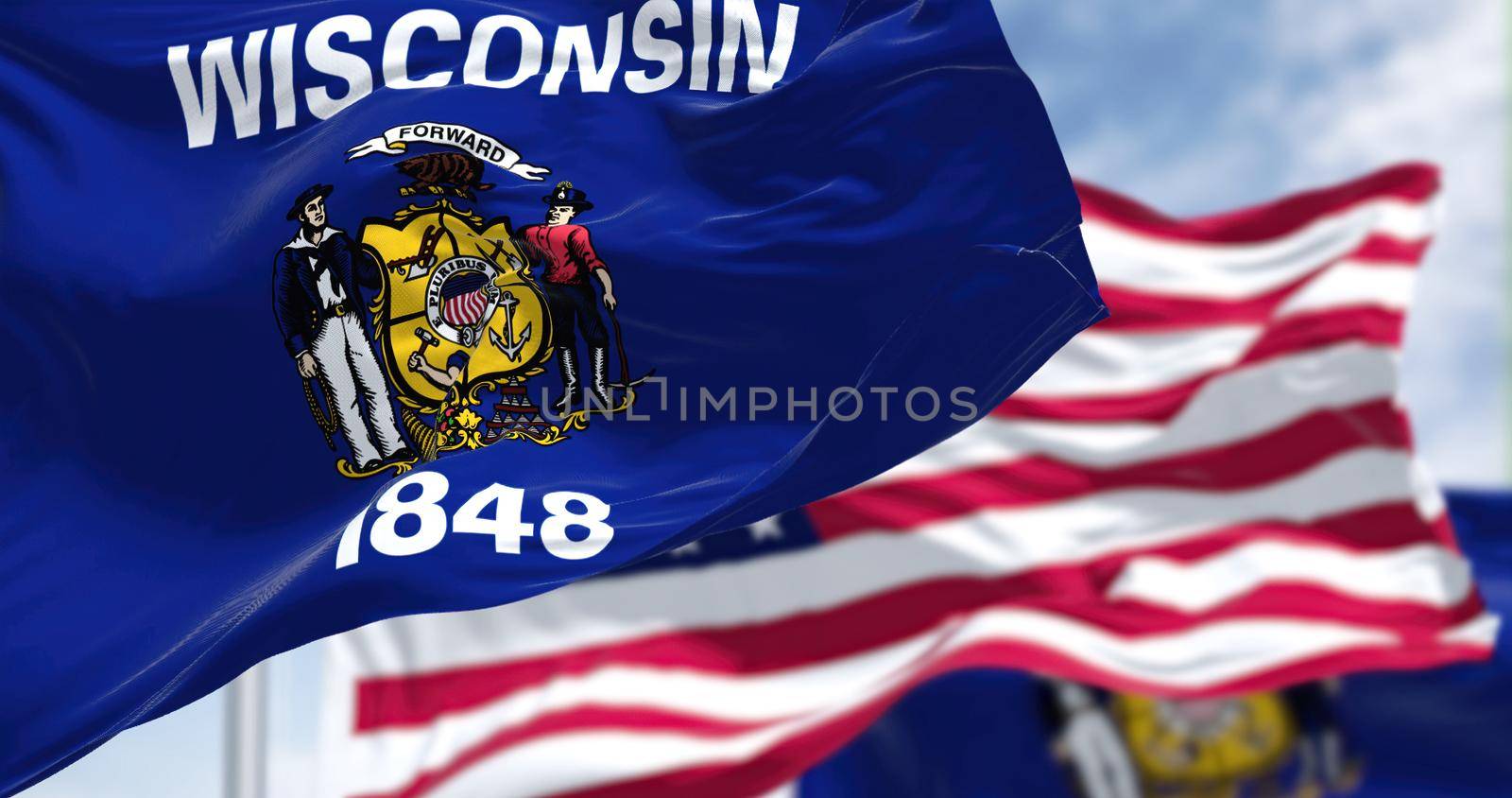 The Wisconsin state flag waving along with the national flag of the US by rarrarorro