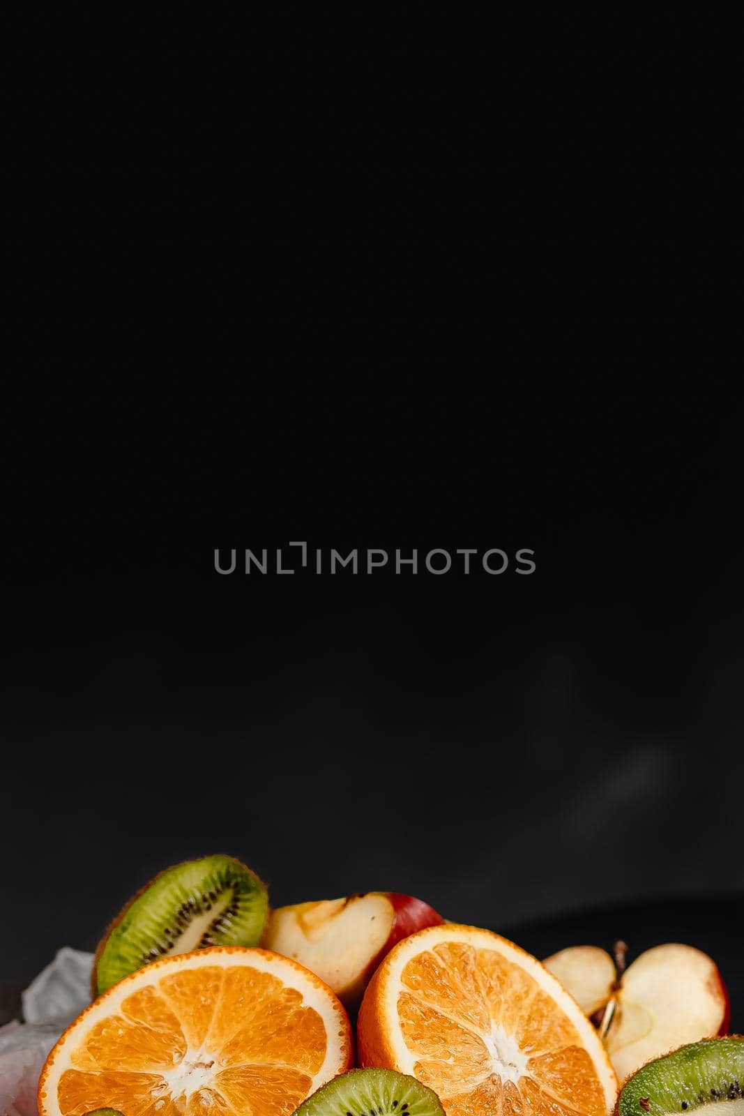 Luxurious fruit background. Studio photography of various fruits isolated on black background. Copy space. high resolution product