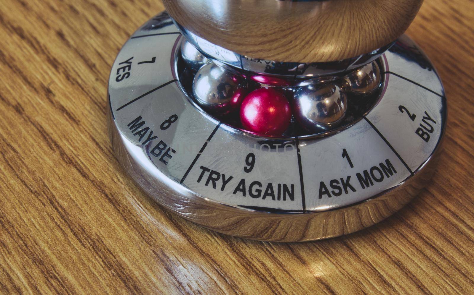 Metal decision maker with 'Try again' selected from the wheel of options