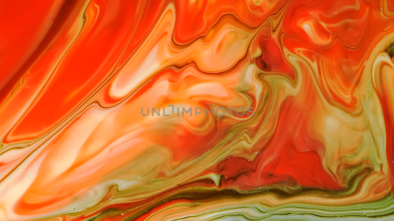 Marble texture of a red background with streaks. Dark lines on a red-yellow background. The fluid art of resin and paints in macro photography. Unique author's design.