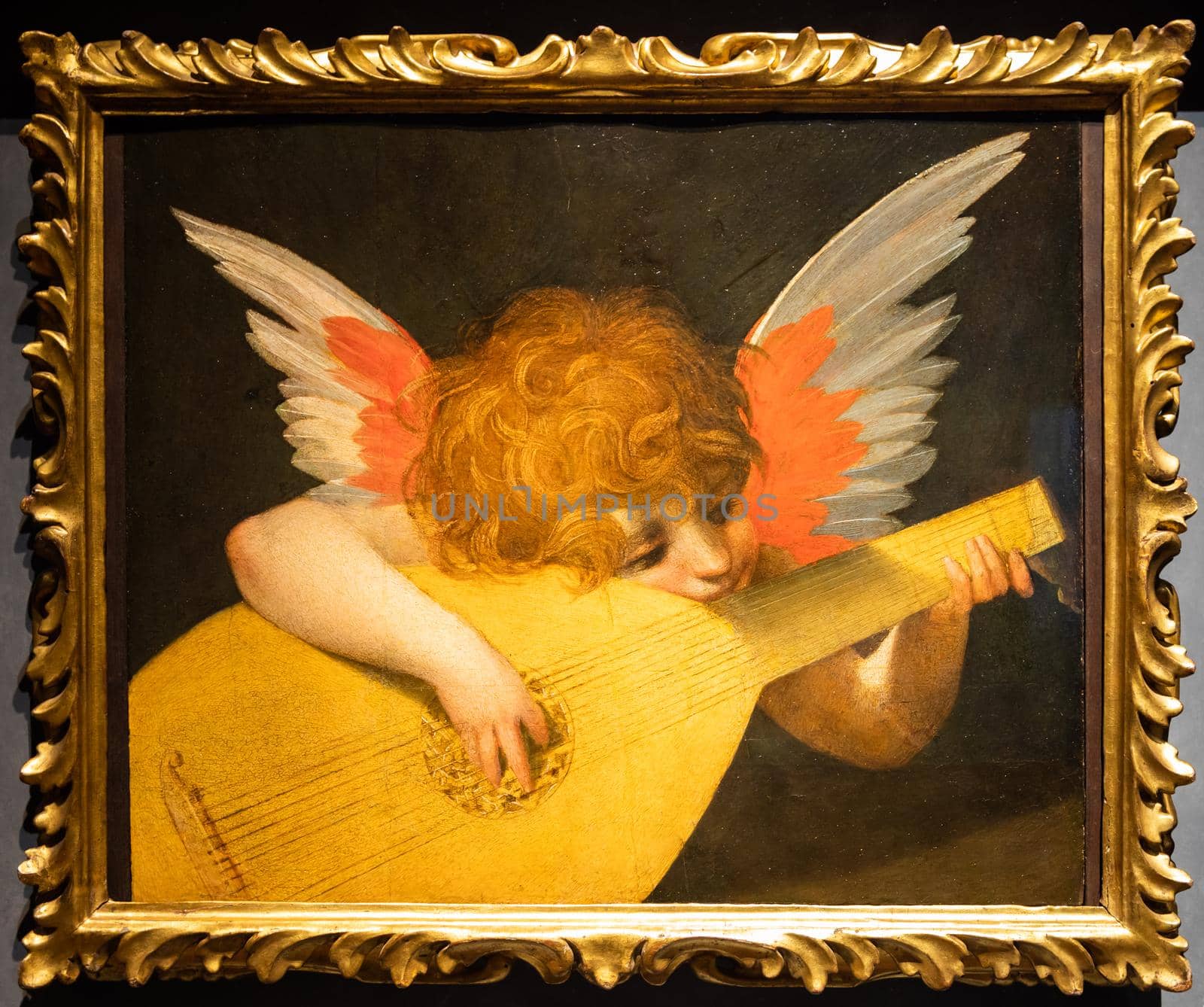 Florence, Italy - Circa August 2021. Angel playing a lute by Rosso Fiorentino, c.1521 - oil on panel
