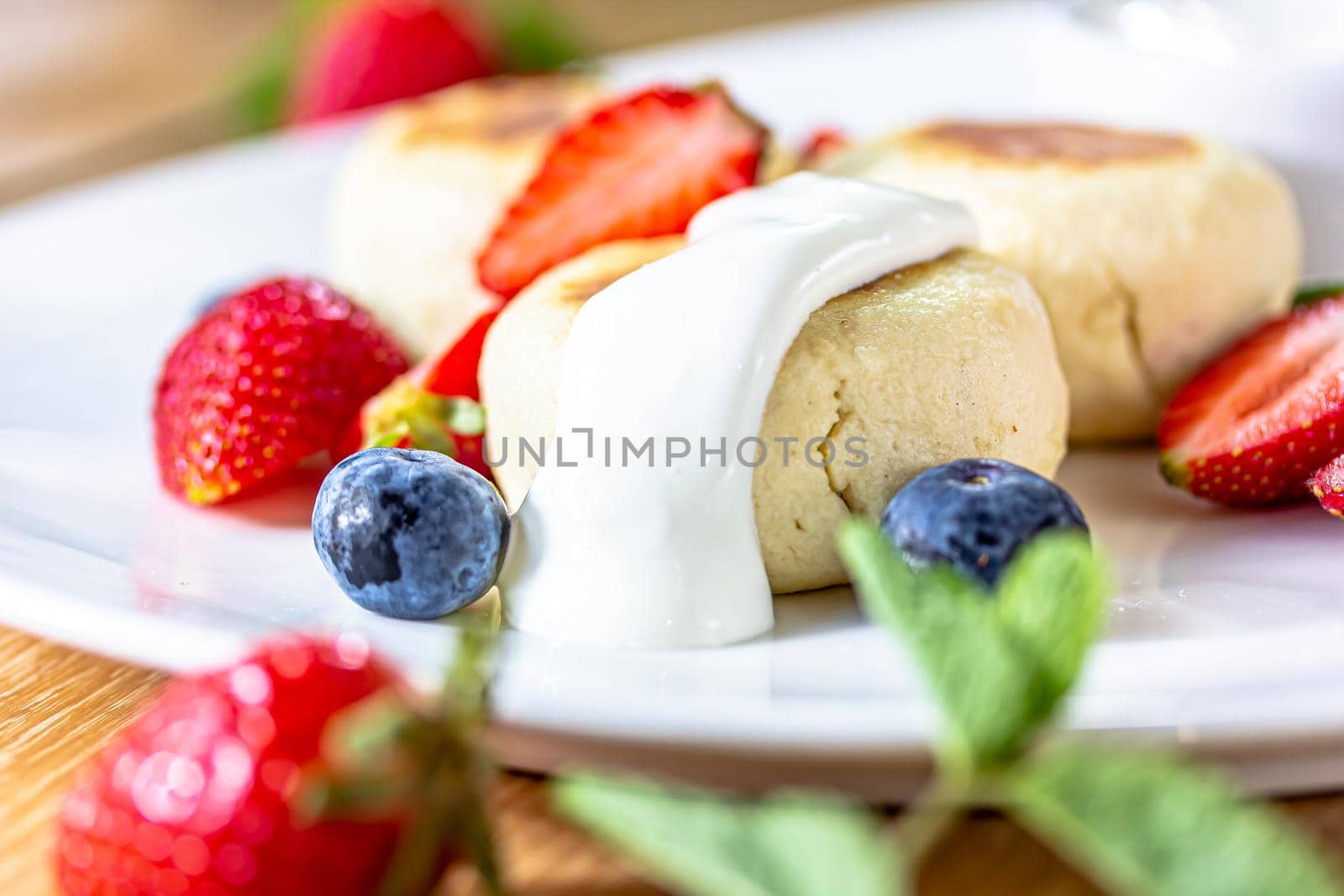 Homemade cheesecake with fresh strawberries and blueberries dessert - healthy organic summer dessert pie cheesecake. Vanilla Cheese Cake by Milanchikov