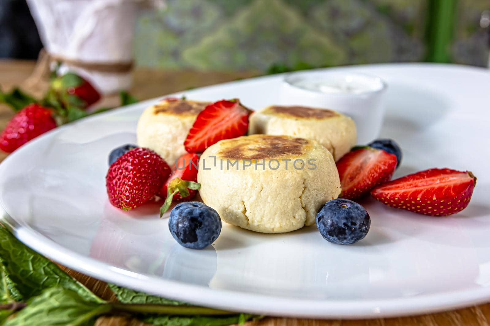 Homemade cheesecake with fresh strawberries and blueberries dessert - healthy organic summer dessert pie cheesecake. Vanilla Cheese Cake by Milanchikov