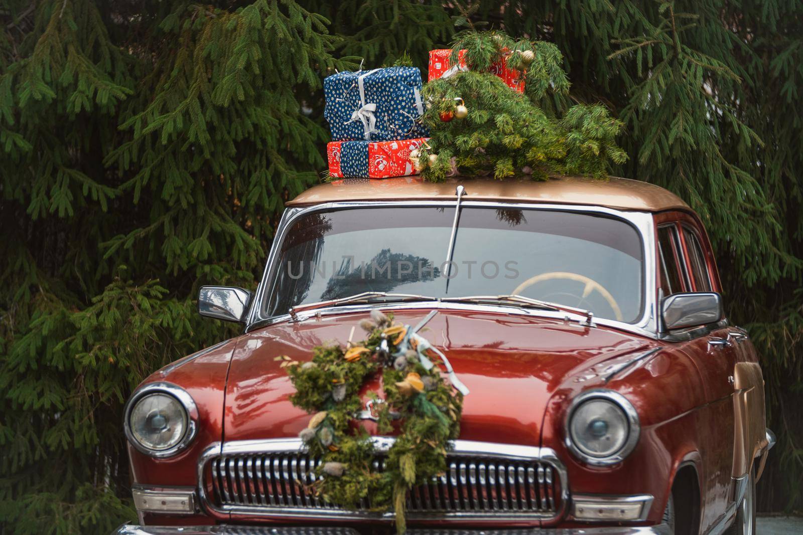 retro red car with gifts on the roof