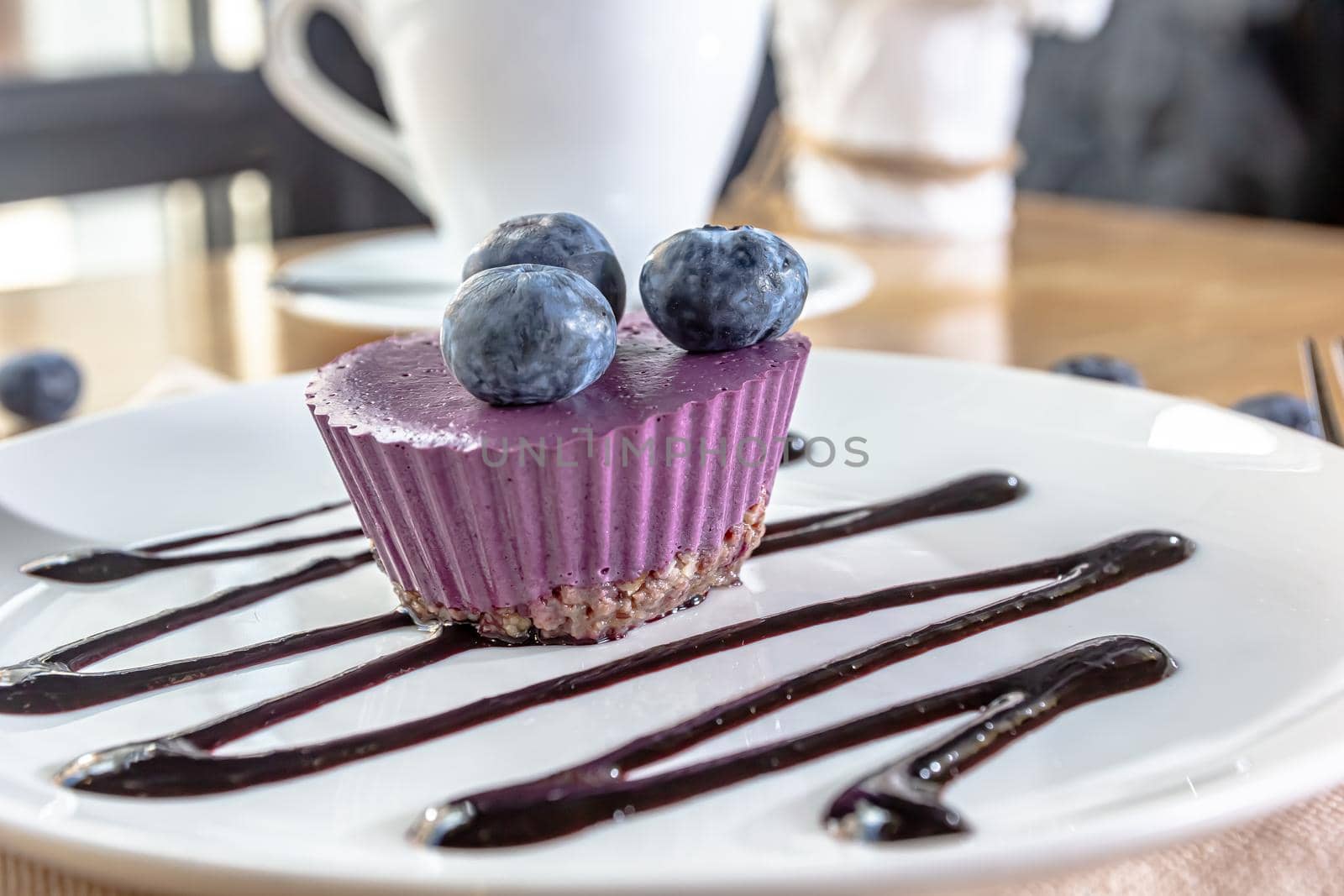 Delicious cake with blackberry-blueberry mousse. Closeup view.