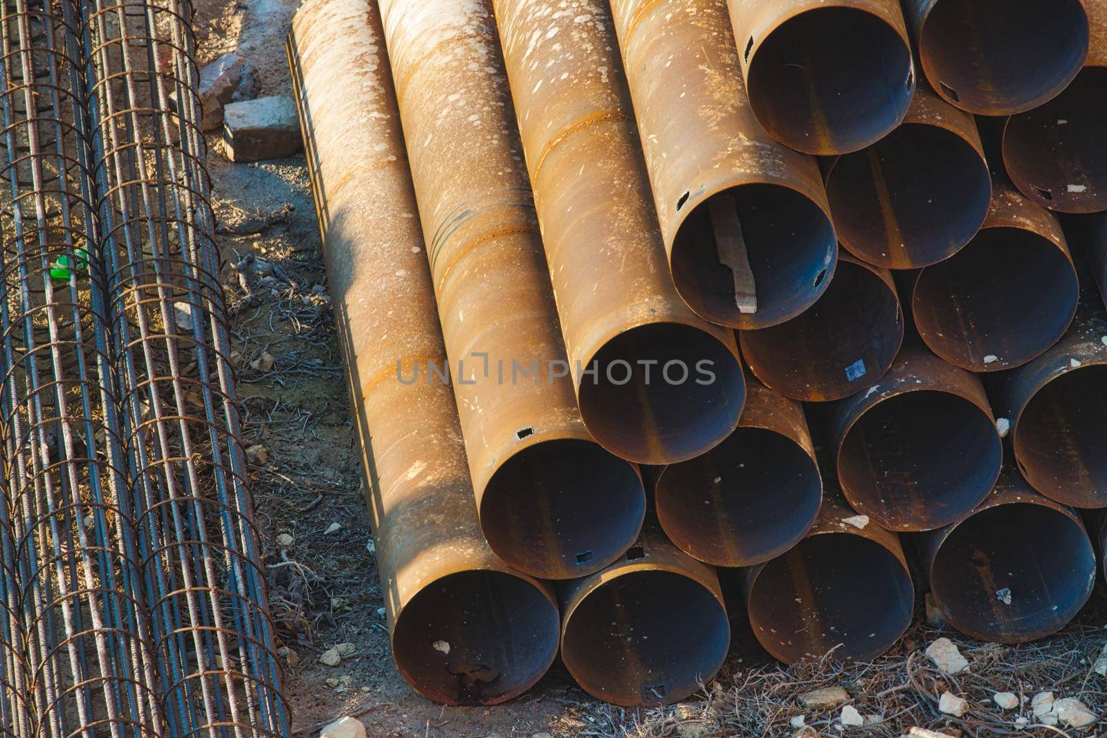 Industrial construction material - pipes stacked in a pyramid