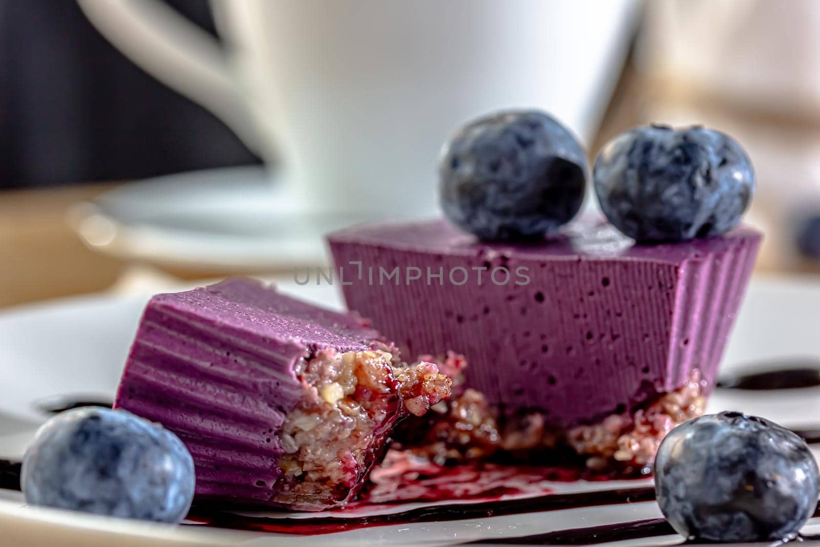 Delicious cake with blackberry-blueberry mousse. Closeup view by Milanchikov