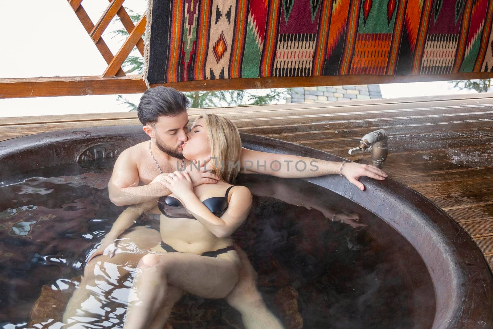 young couple bathing in a vat by zokov