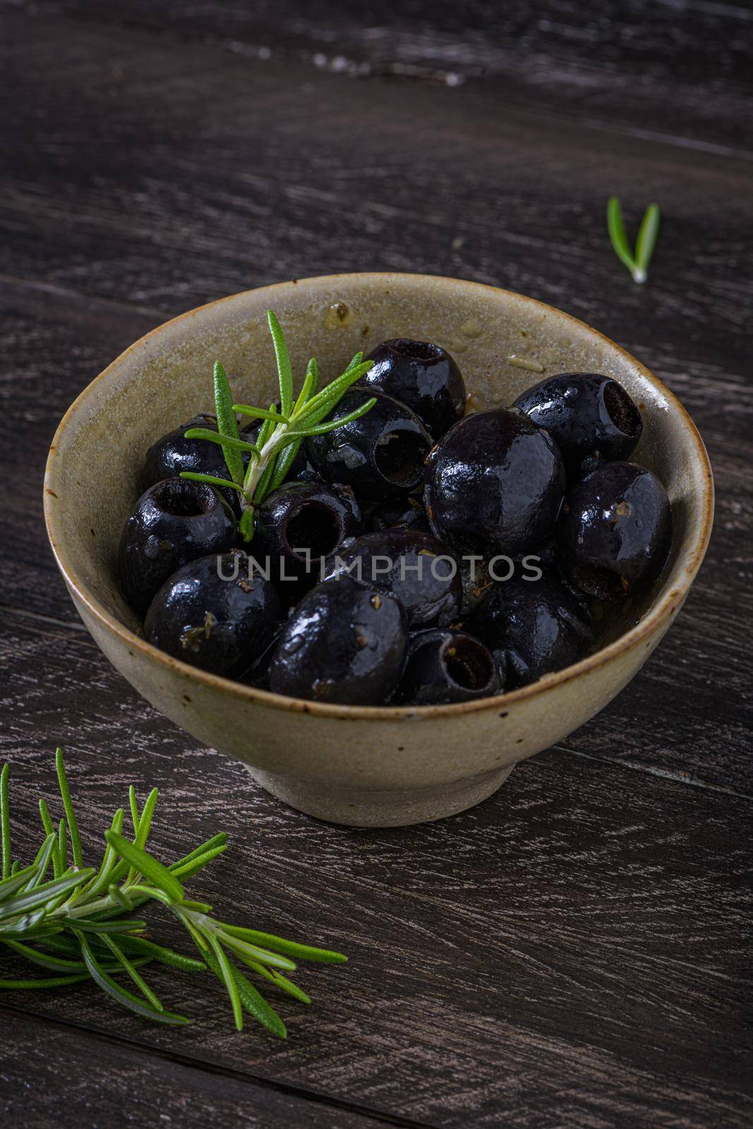 Olives in a ceramic bowl  by homydesign