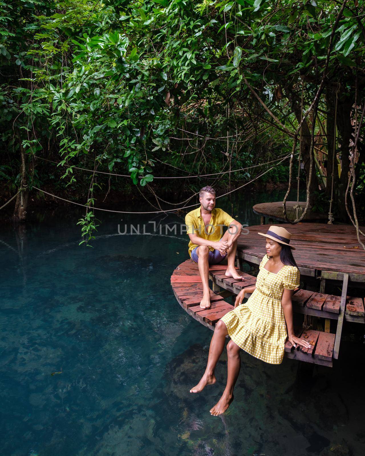 Klong Sa Kaew Krabi Thailand mangrove forest popular for kayaking in the river of Krabi Thailand. Young Asian woman and European men at the lake by fokkebok