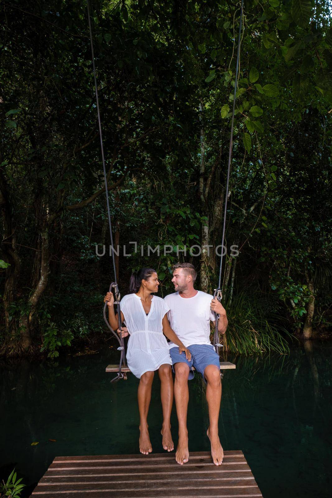 Klong Sa Kaew Krabi Thailand mangrove forest is popular for kayaking in the river of Krabi Thailand. Young Asian woman and European men at the lake