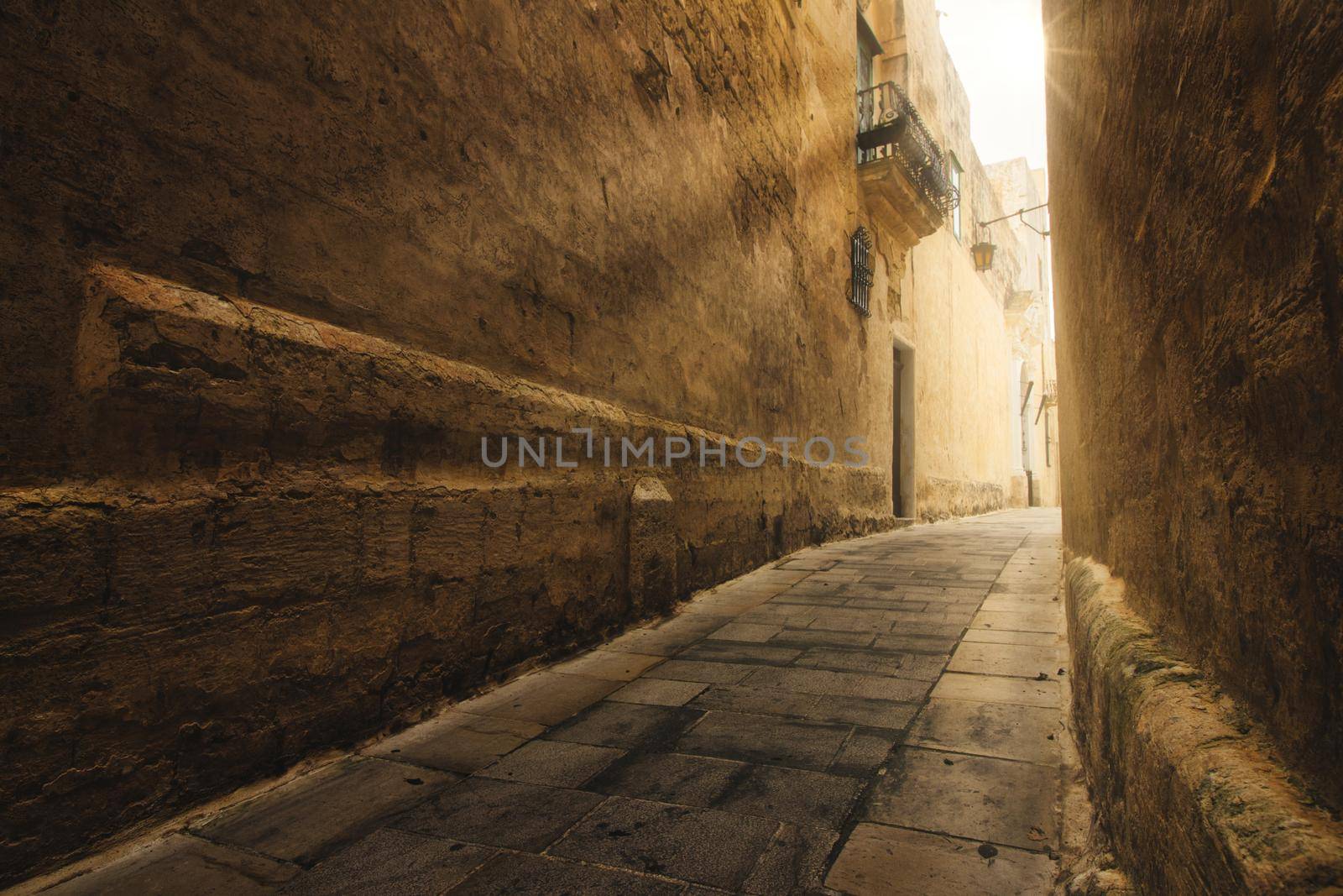 Narrow street in the medieval historic city of Mdina, Malta
