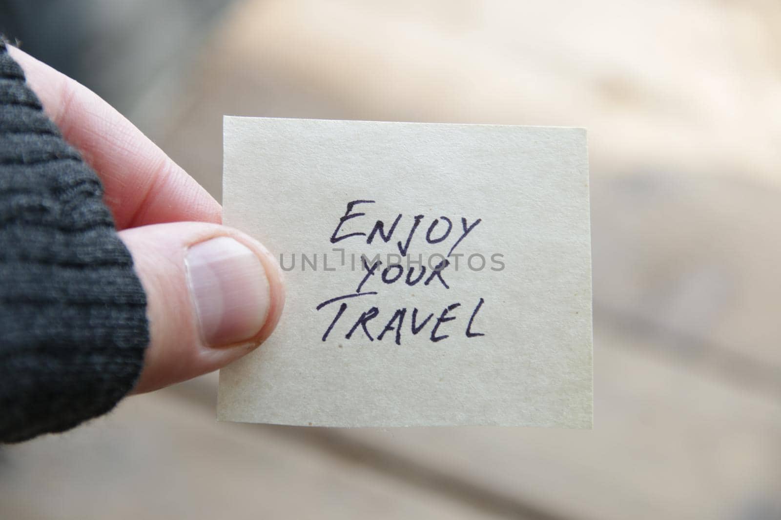 Enjoy your travel concept. The inscription on the tag.