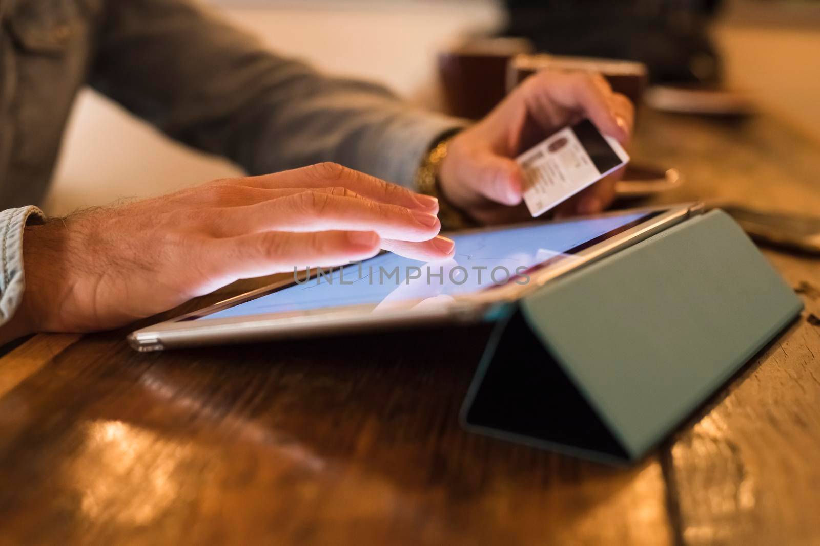 man shopping on line using a credit card