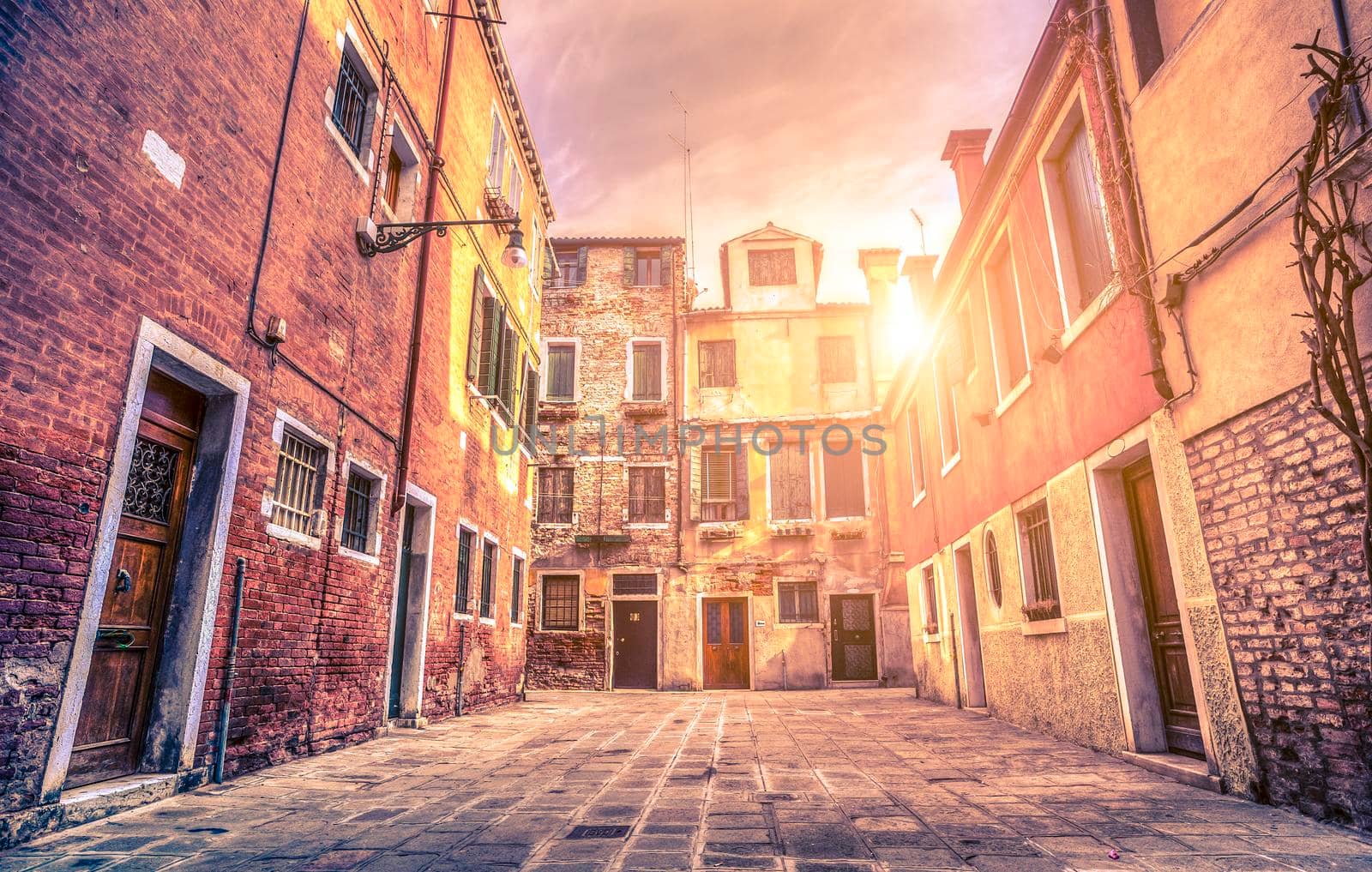 Sunset scene in old square in Venice Italy