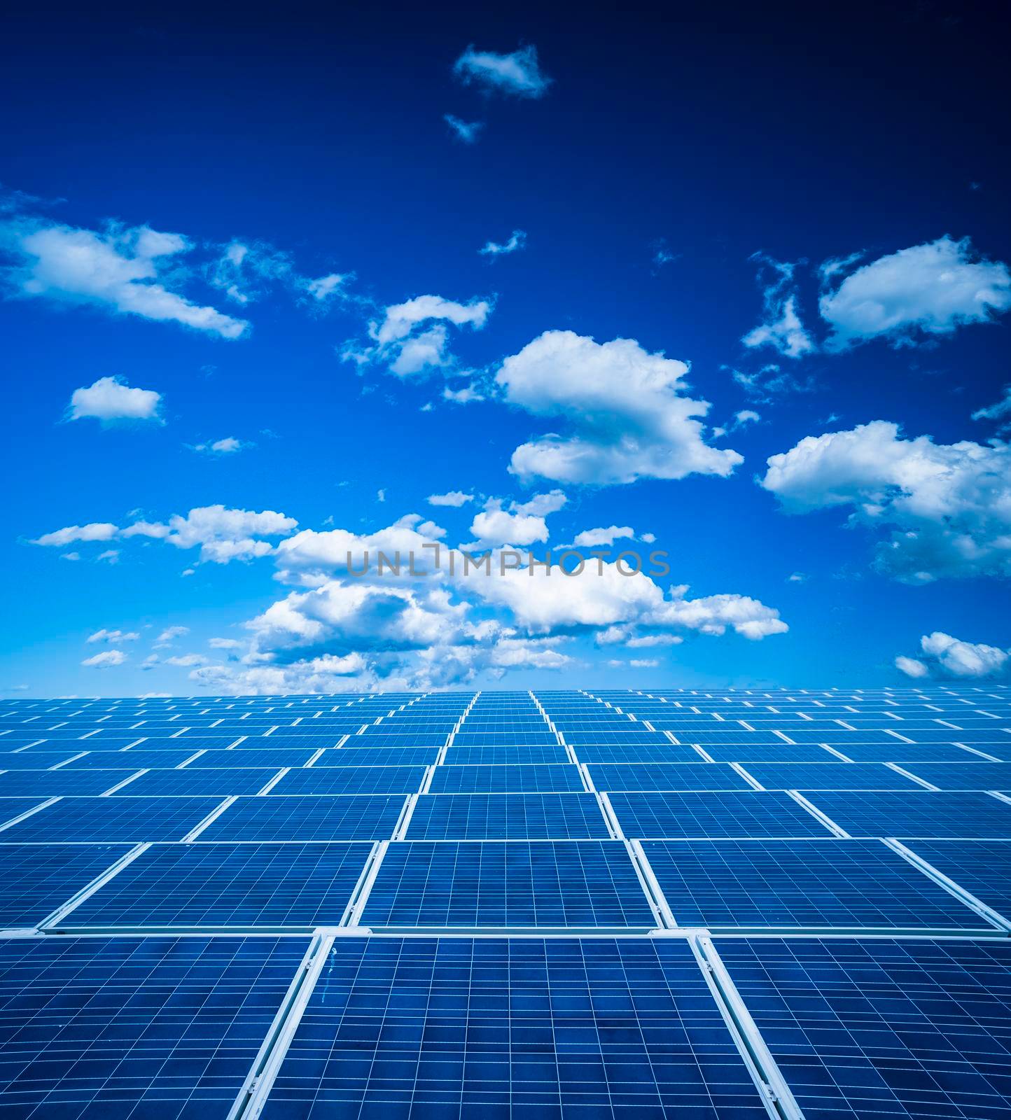 Blue photovoltaic solar panel horizon background with sky