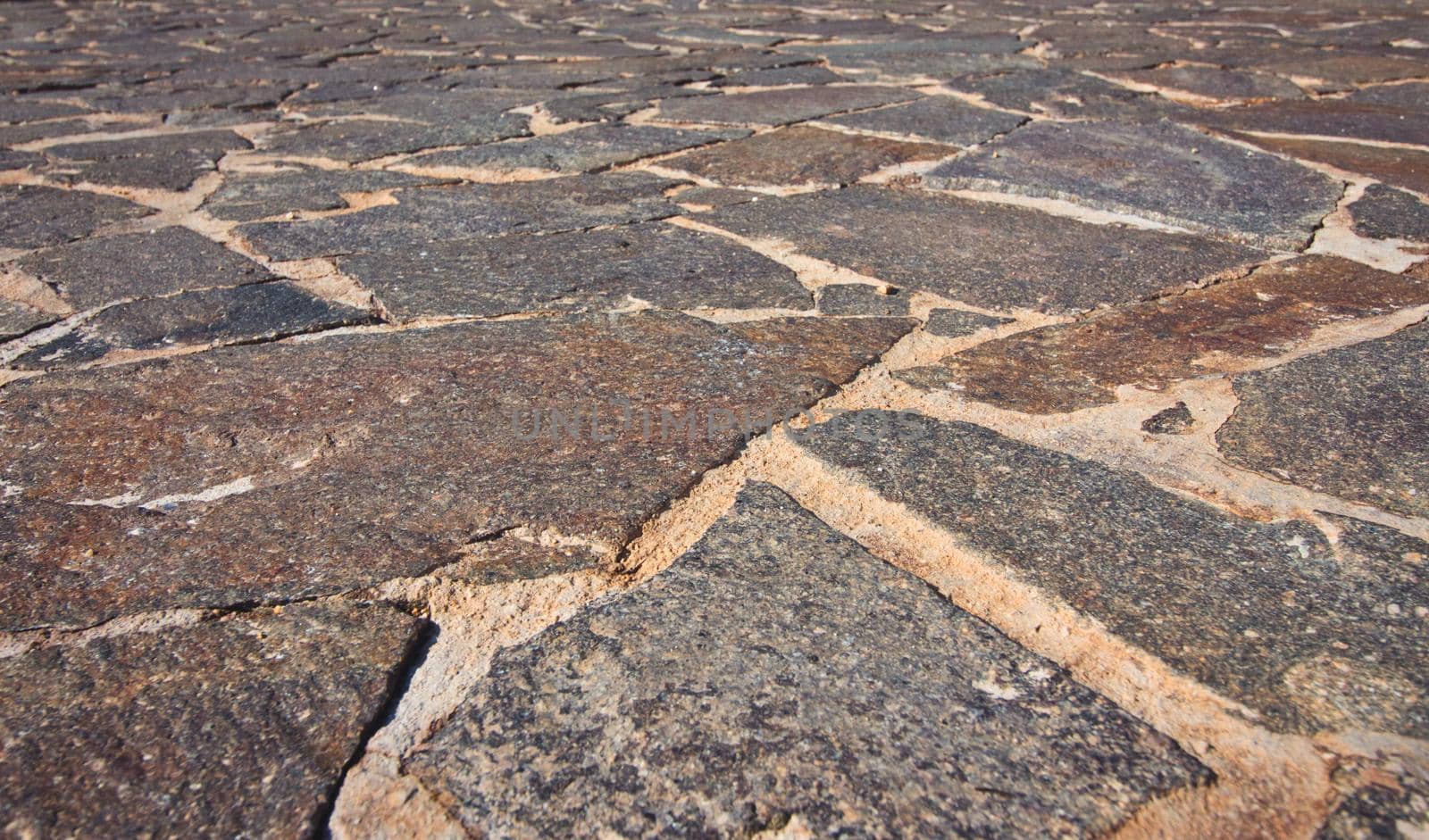 Low wide-angle view of textured crazy paving mosaic floor