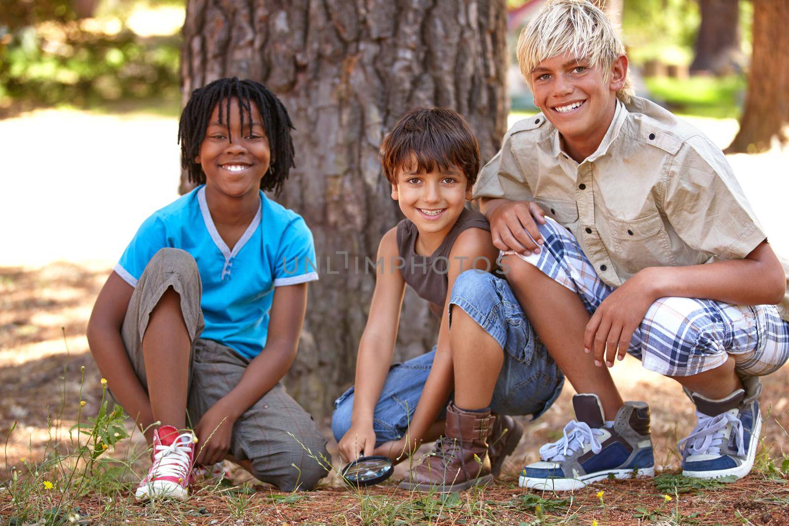 Shot of young boys enjoying the outdoors while camping.