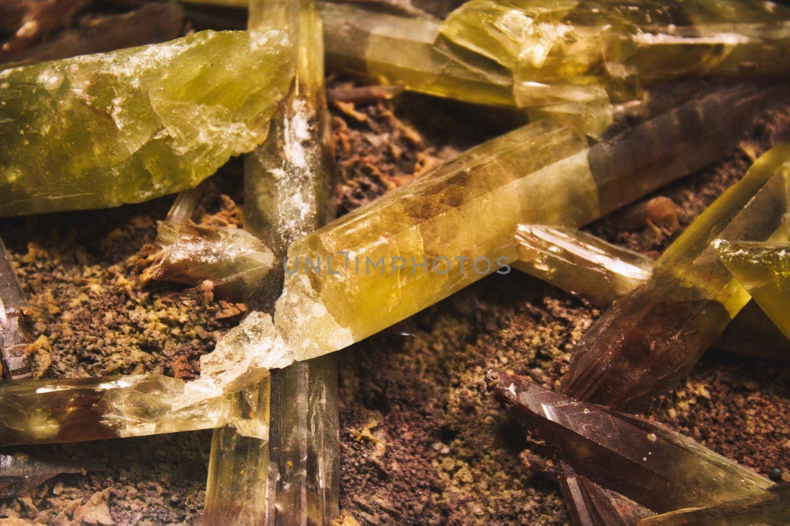 Yellow and brown quartz crystal shards embedded in mineral rock