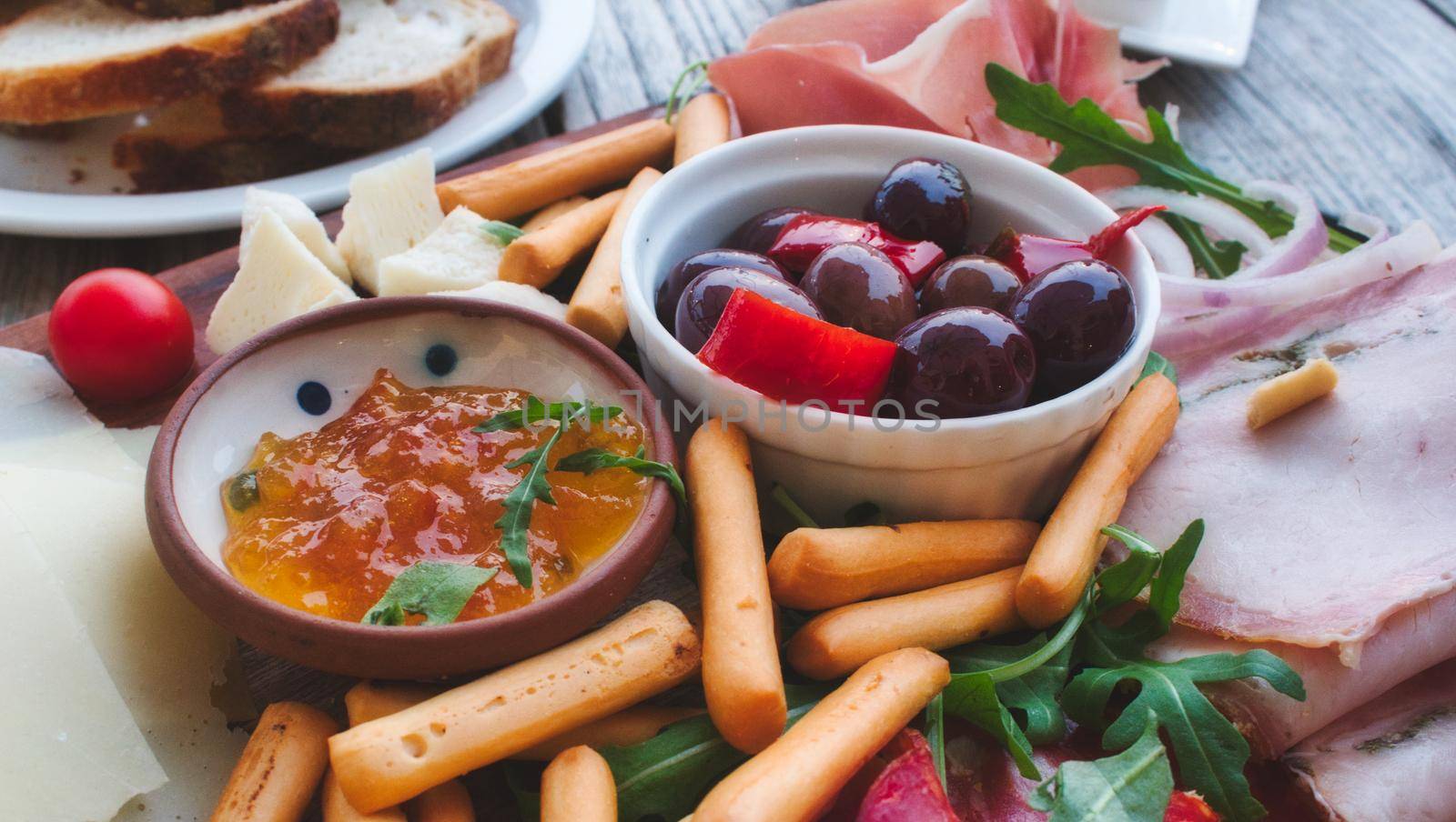 Close up of Mediterranean mixed platter to share with a selection of meats and cheeses