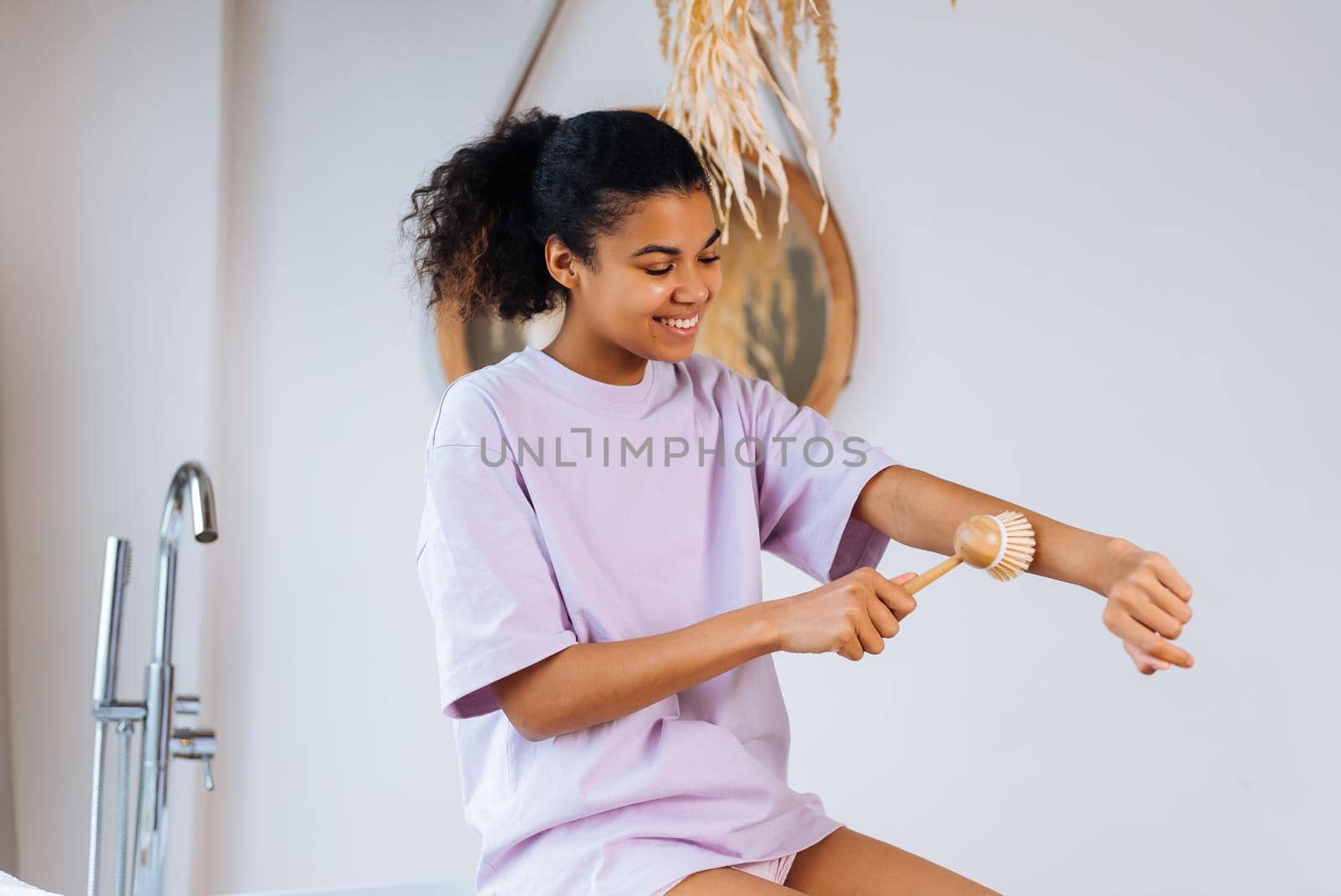 African american woman takes care of her skin in the bathroom , close view