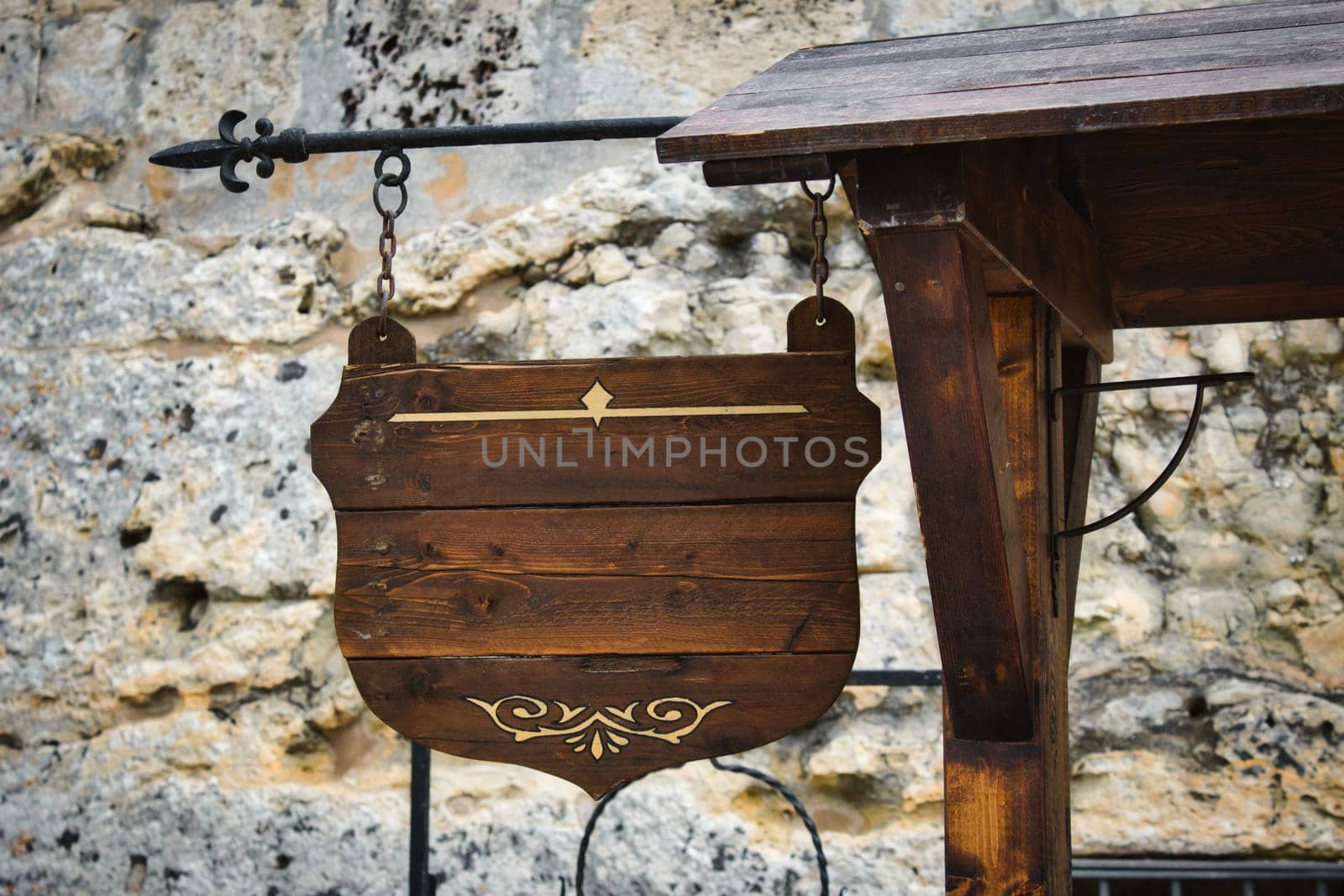 Old-fashioned traditional wooden sign hanging with empty space for text