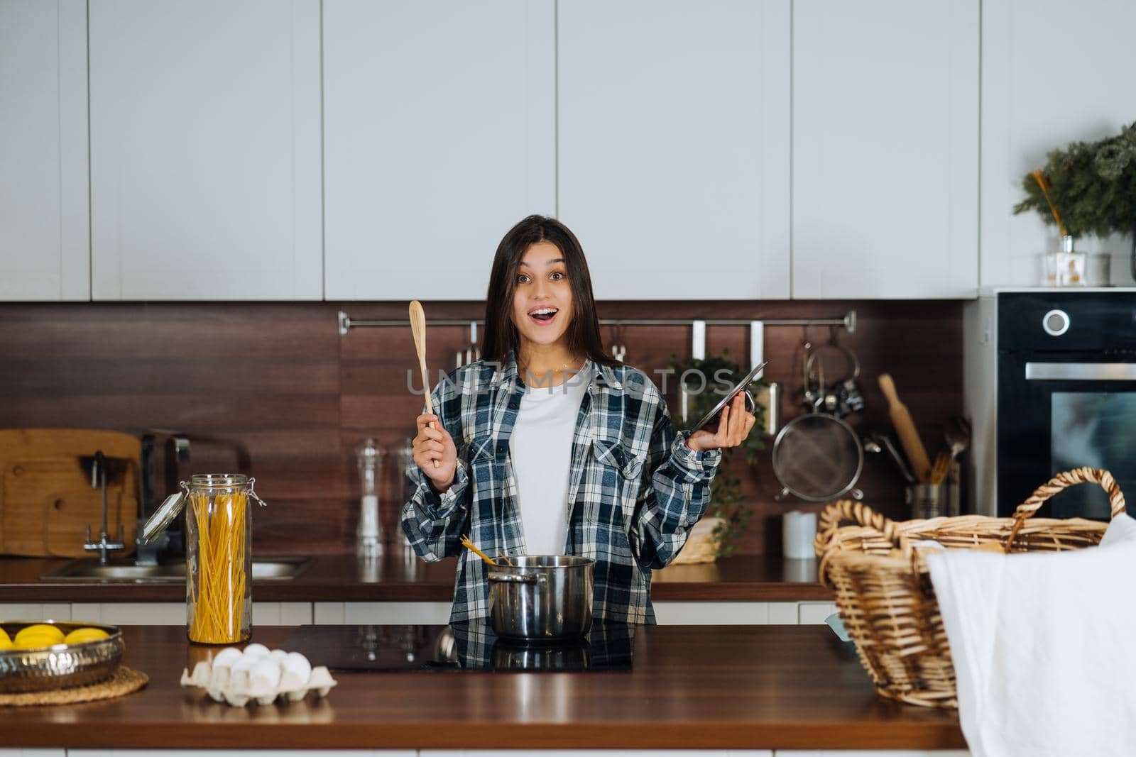 Woman is preparing food in the kitchen. Cooking At Home. Prepare Food.
