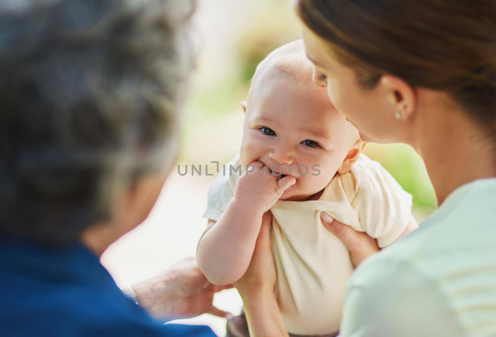 Cropped shot of a three generational family spending time outdoors.