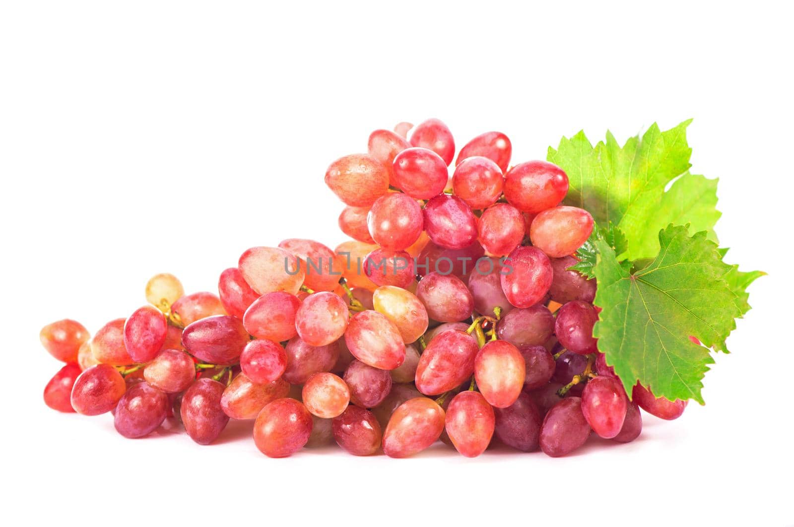 Ripe red grape with leaves isolated on white