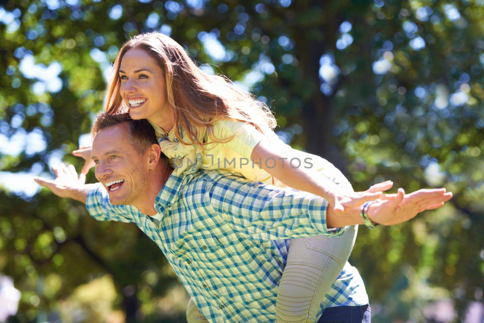 Shot of a playful couple enjoying the summer sun.
