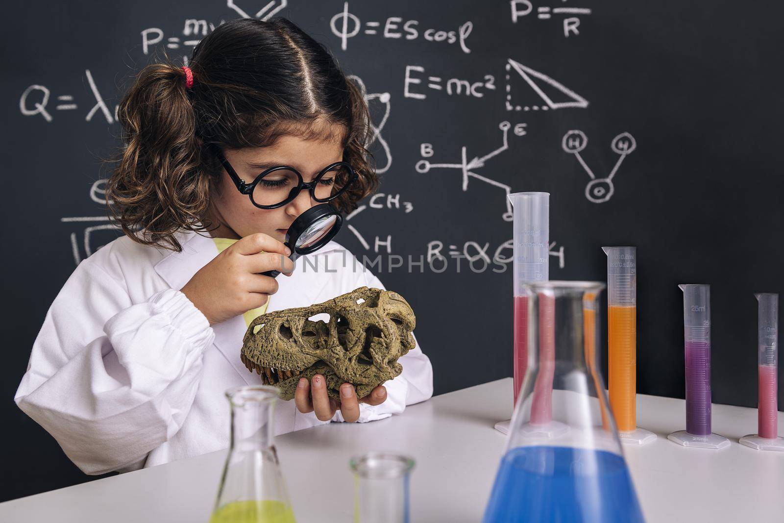 scientist child studying a dinosaur skull by raulmelldo