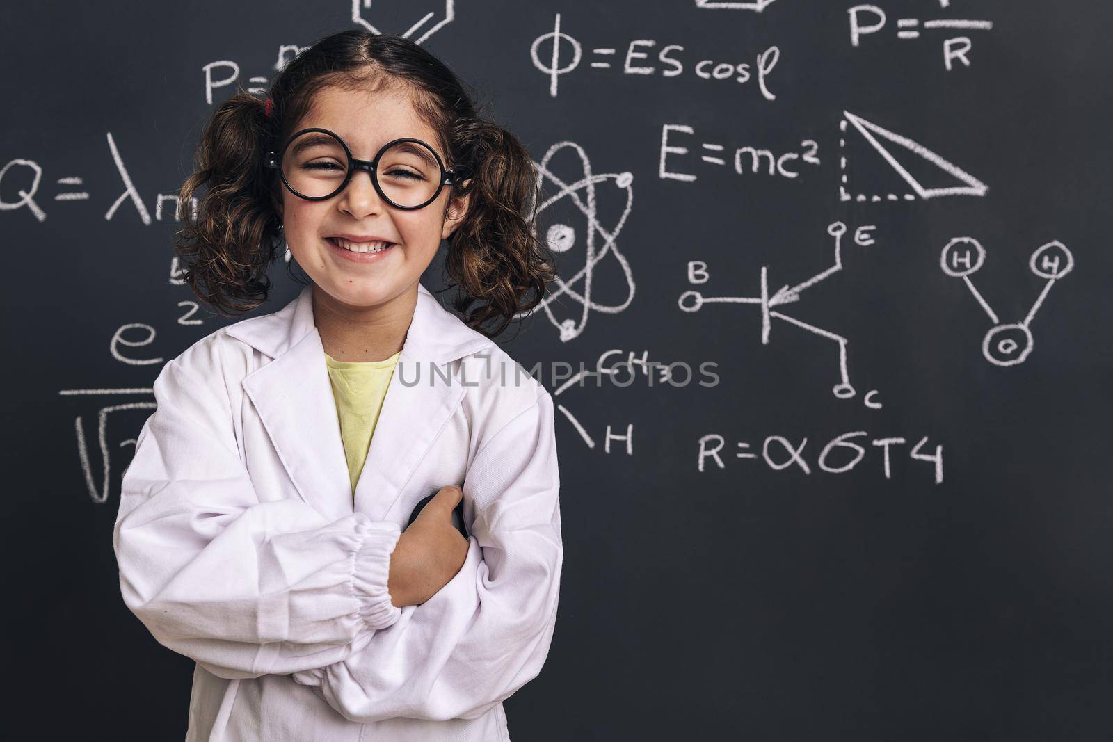 smiling little girl scientist in lab coat by raulmelldo