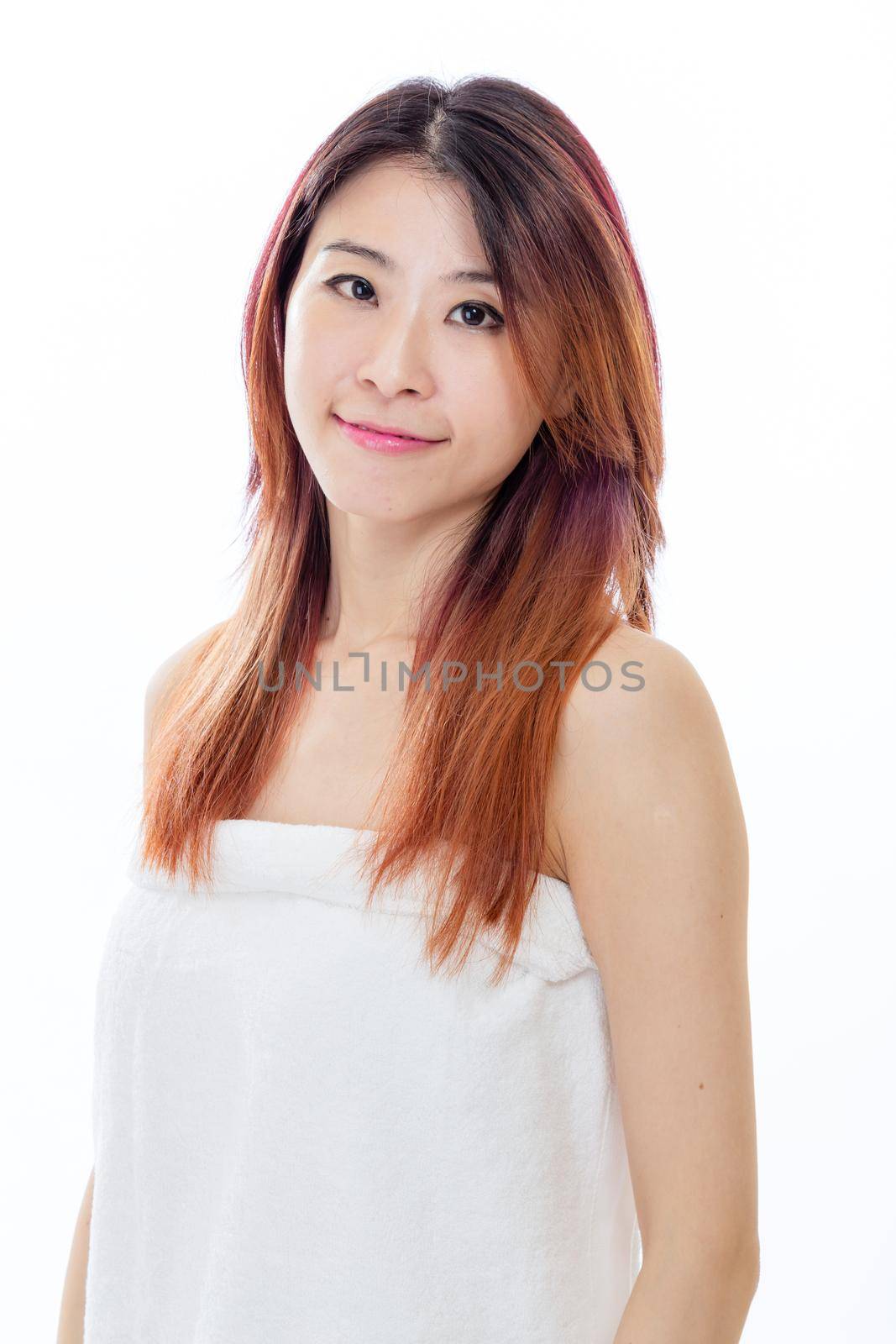 Chinese American woman wearing a white towel, beauty concept by imagesbykenny