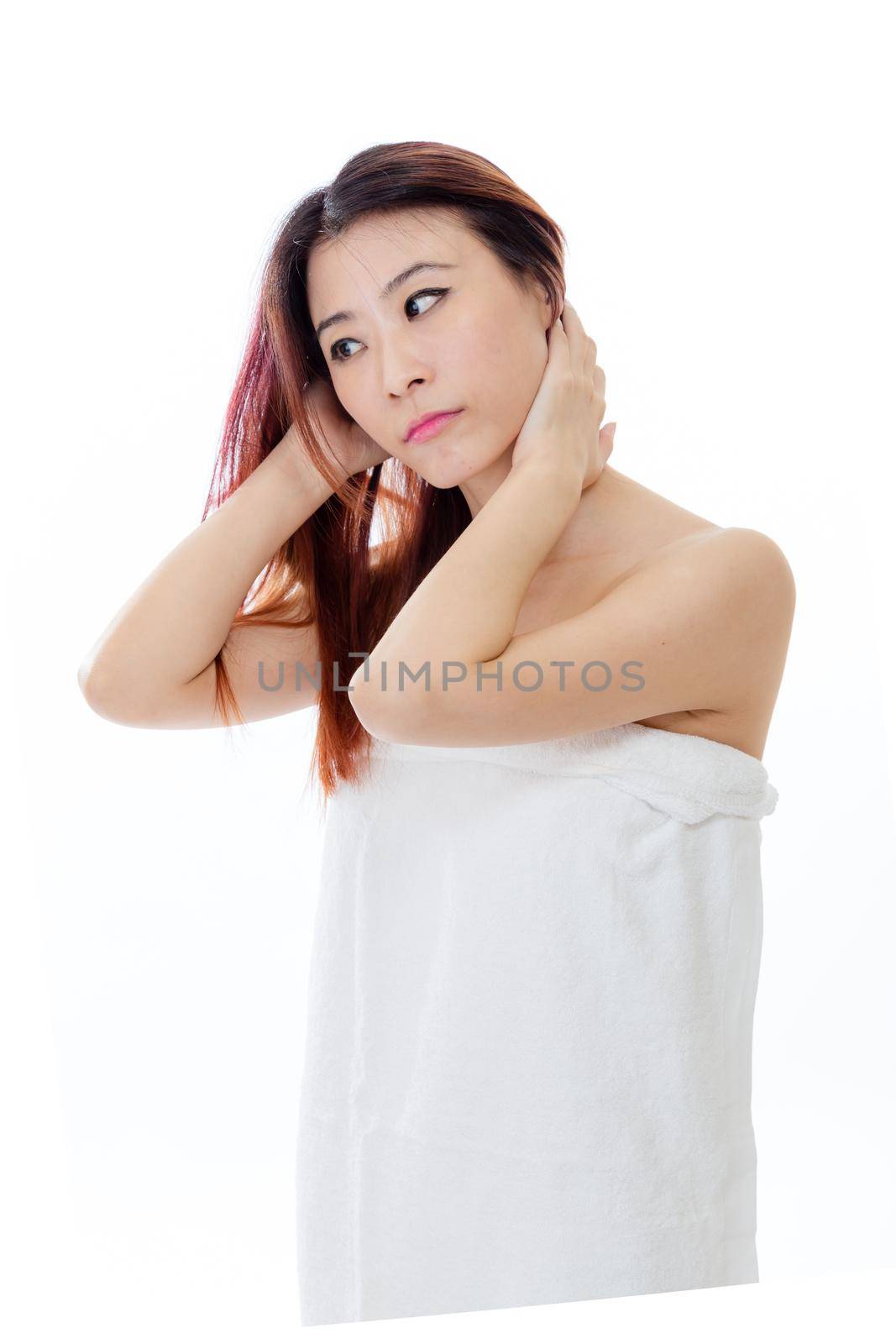 Chinese-American woman wearing a white towel on body, isolated, beauty concept