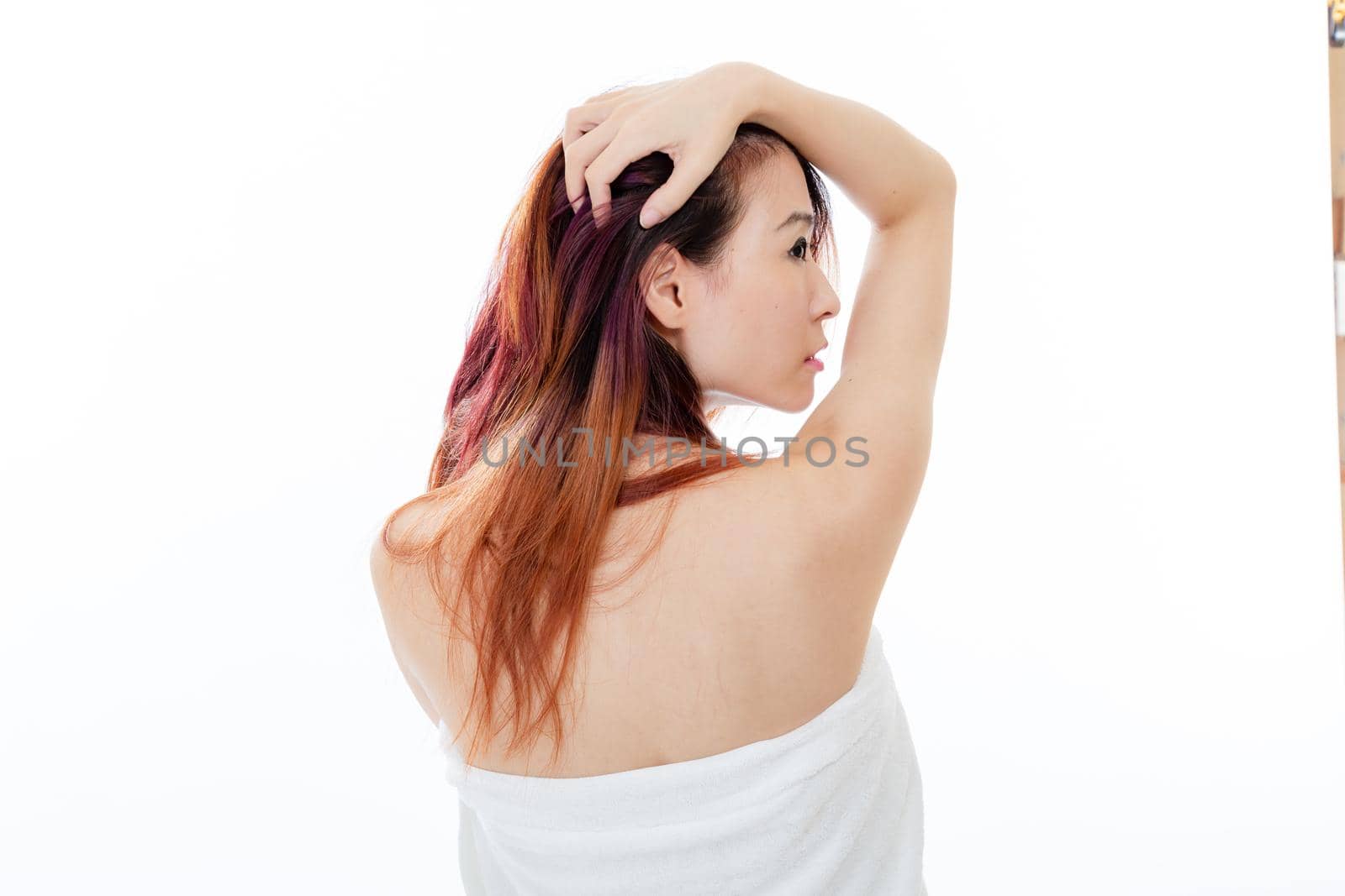 Chinese American woman wearing a white towel, beauty concept, back facing camera by imagesbykenny