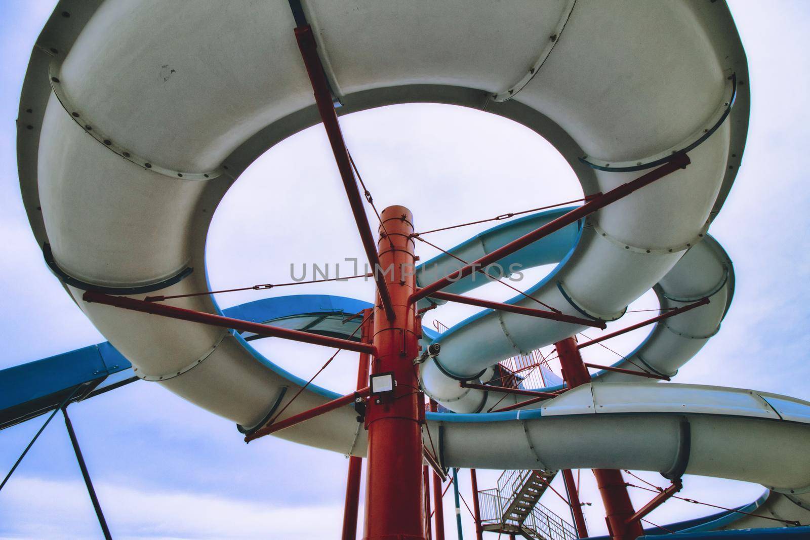 View from below a water slide looking up through the built structure