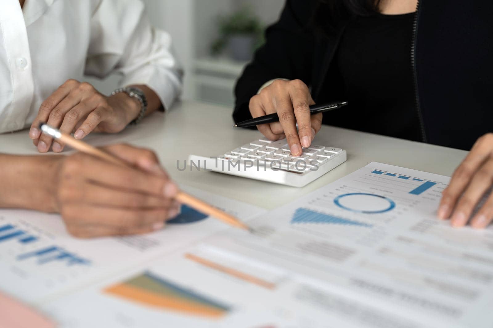 Co-working Business Team meeting Planning Strategy Analysis investment and saving concept. meeting discussing new plan financial graph data on calculator