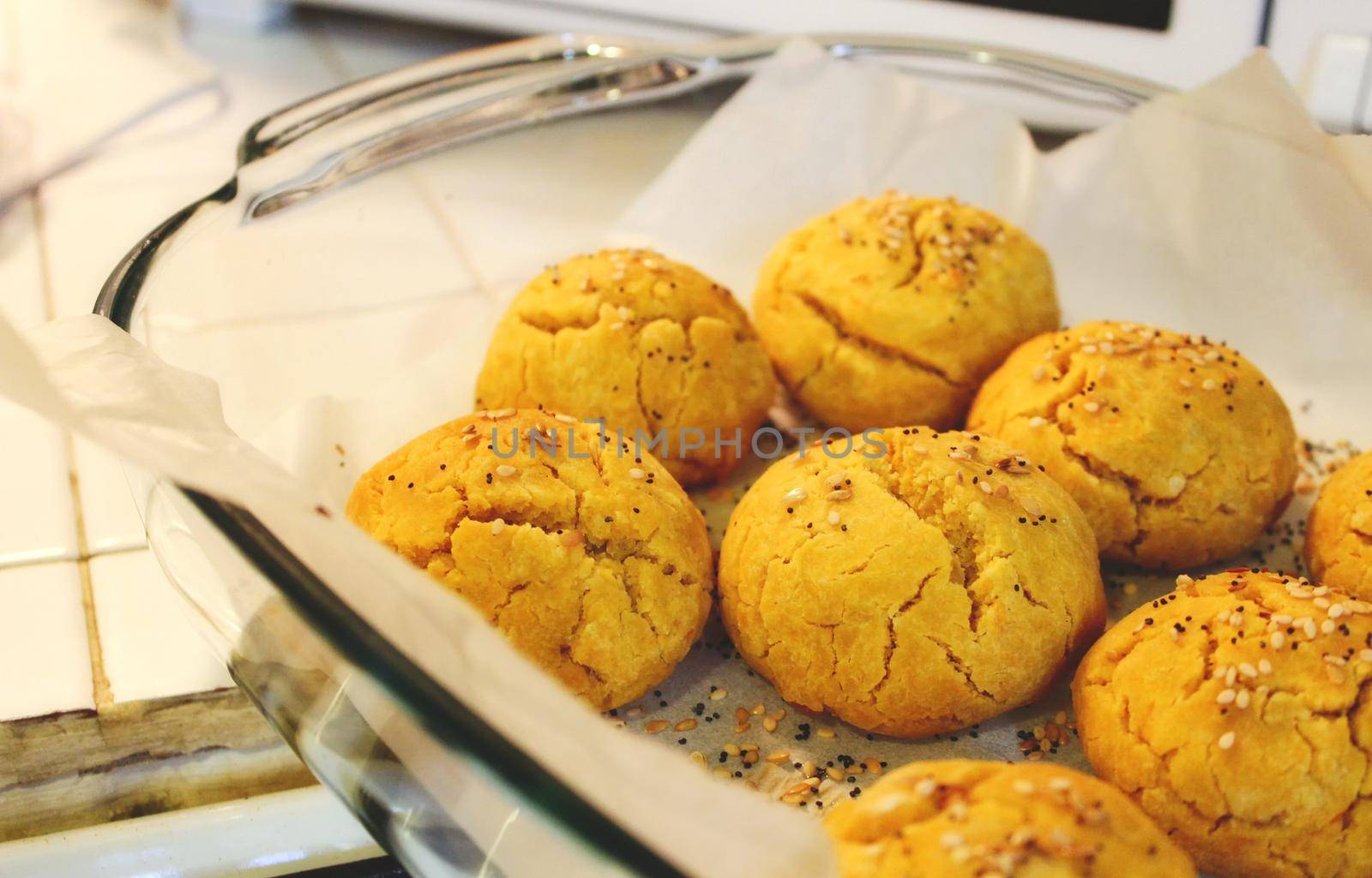 Sweet potato and pumpkin bread rolls freshly baked in a pyrex dish