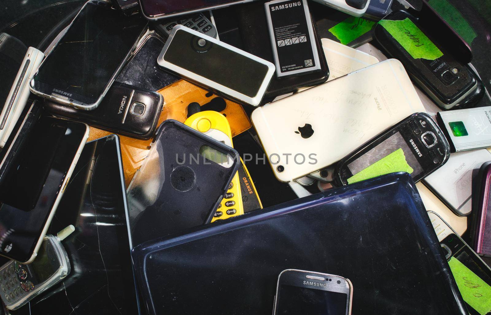 Mosta / Malta - May 11, 2019: Broken mobile digital devices in a bin to be recycled by tennesseewitney