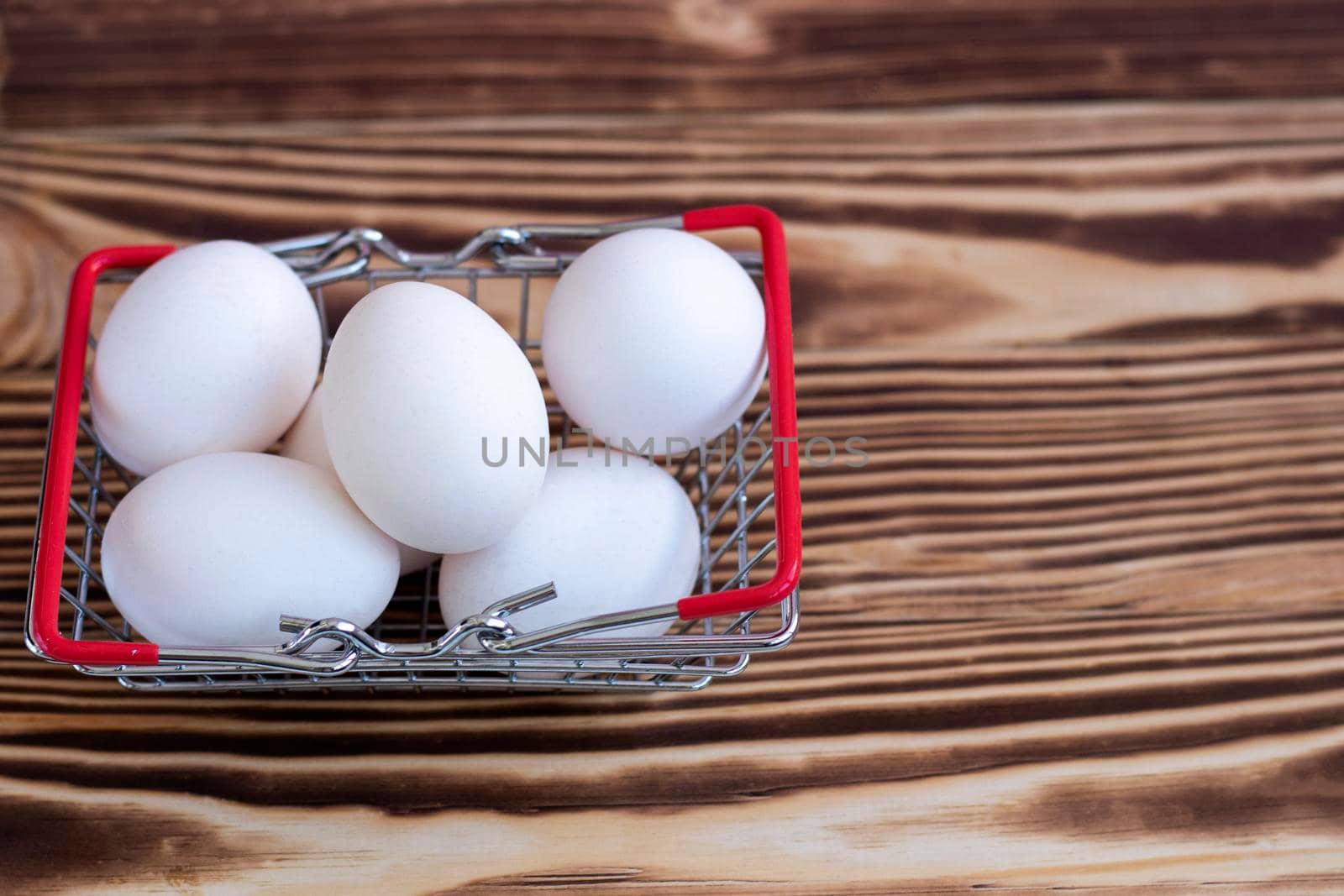 Fresh eggs in a basket. Shopping, purchasing and food delivery concept. High quality photo