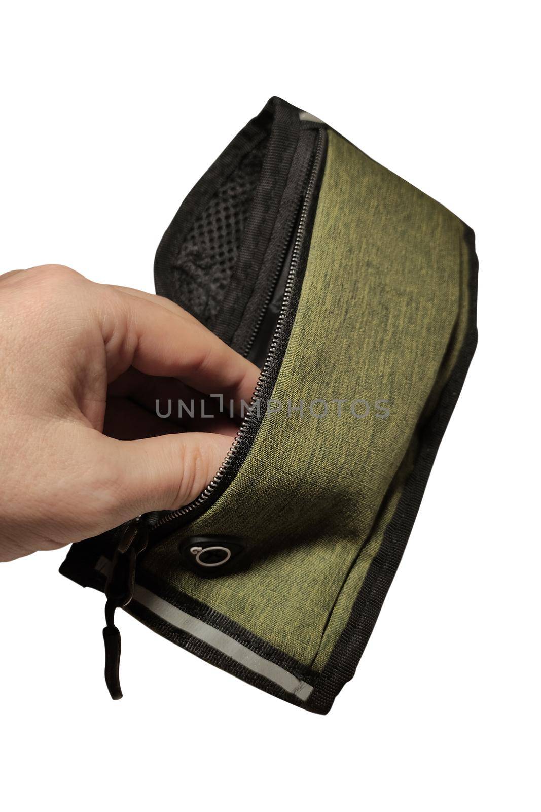 Man's hand opens an empty small sports waist bag isolated on white background