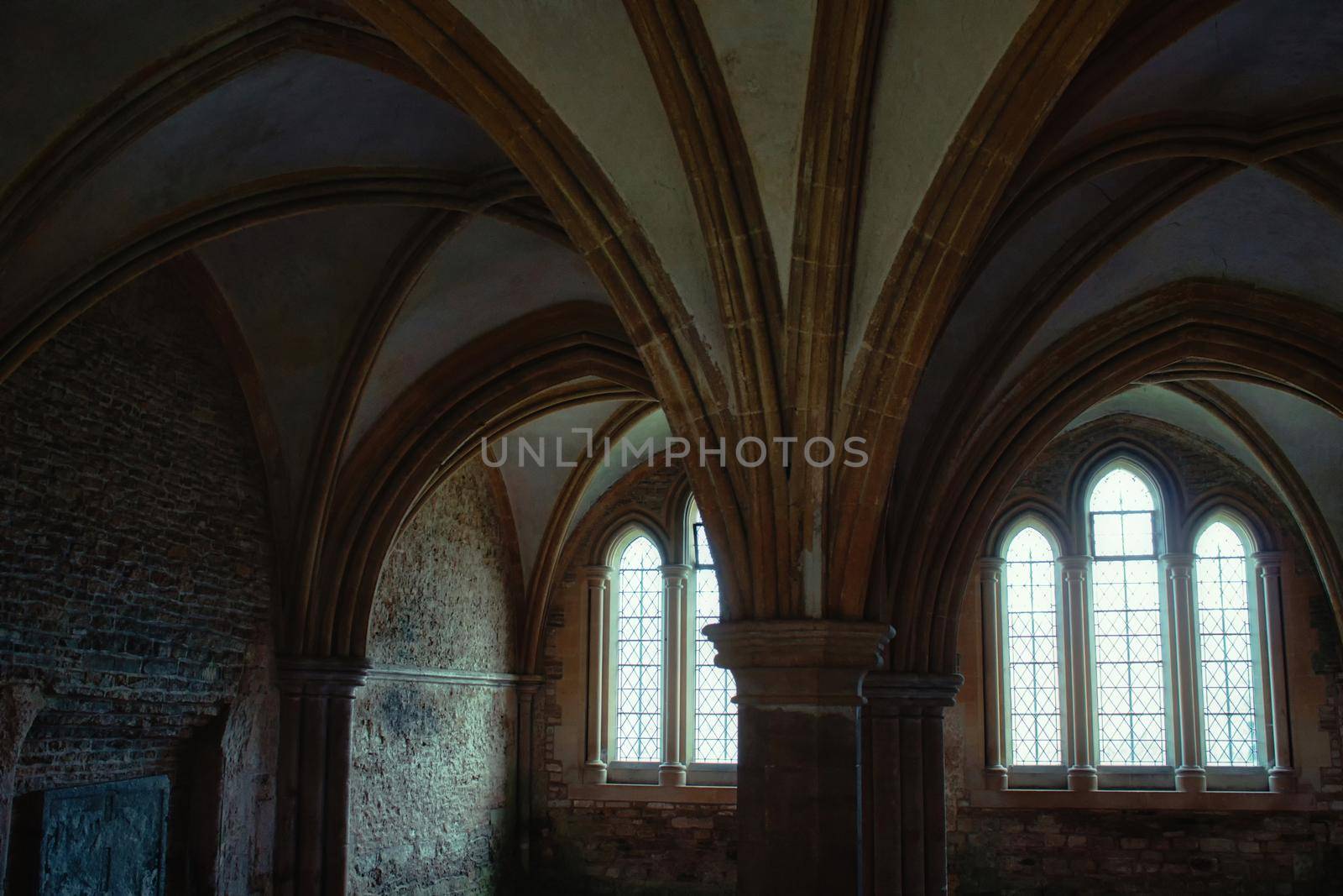 Lacock, England - March 01 2020: Shot of of dark, spooky room in the cloisters at Lacock Abbey