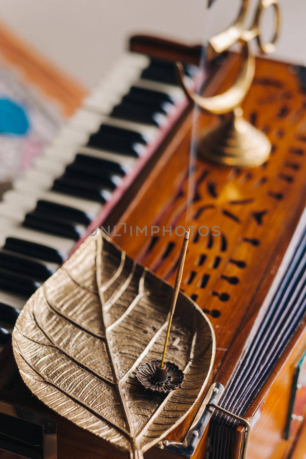 harmonium during the practice of kundalini yoga and the incense standing on it.